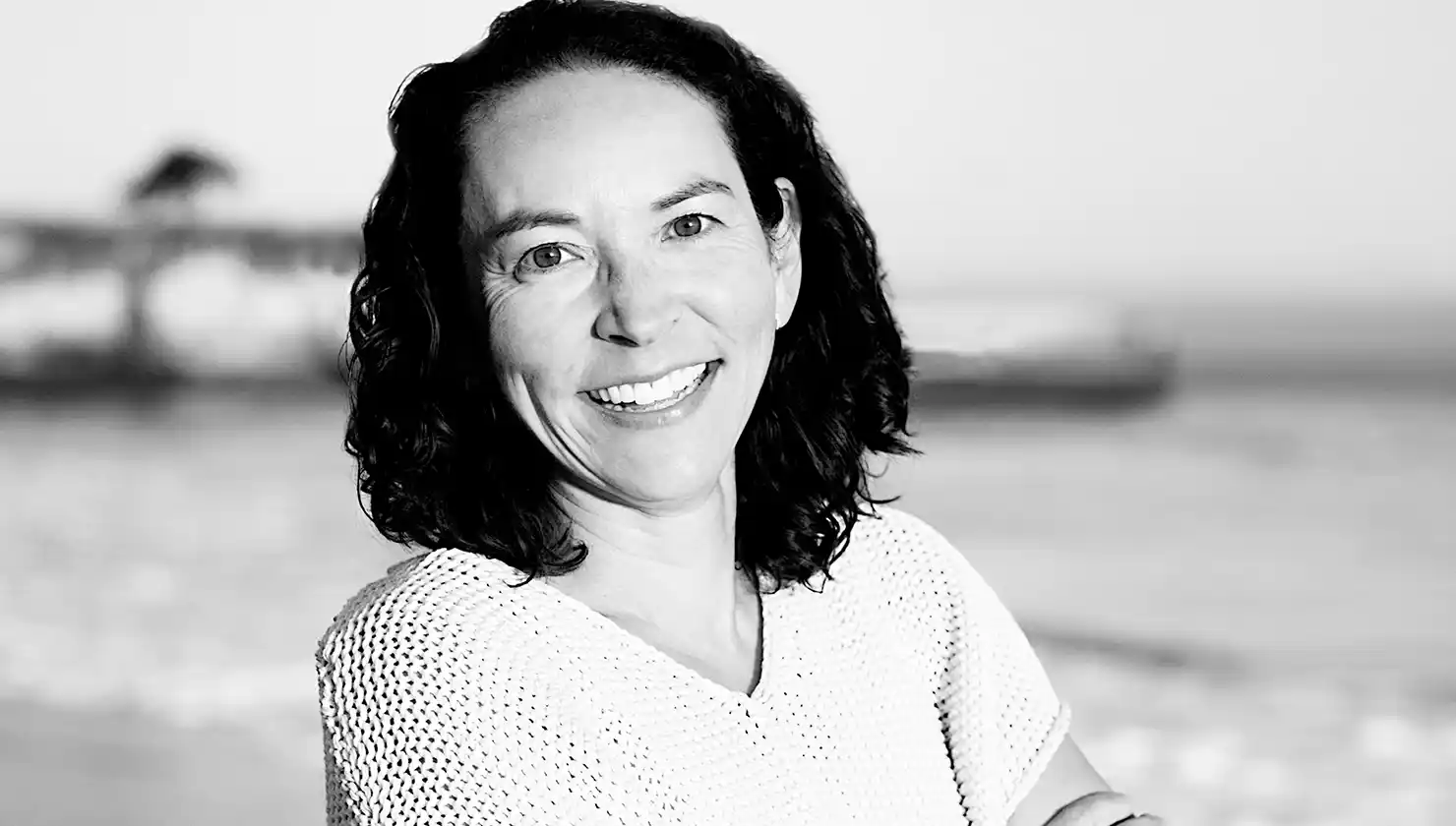 Dr. Joyce Aycock casual headshot on the beach