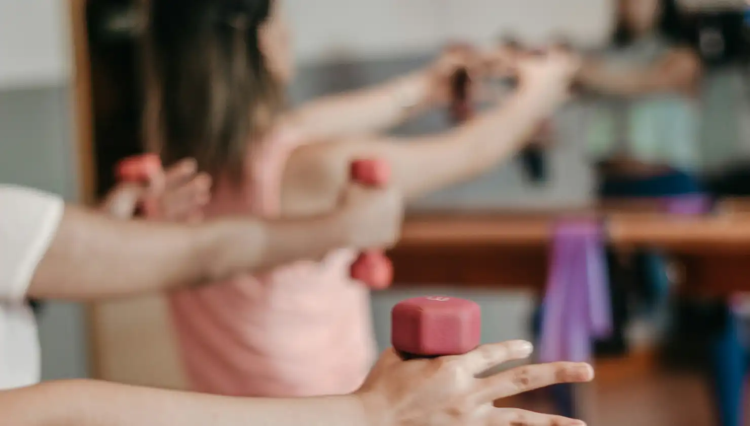 potential breast reduction patient. women in a group fitness class